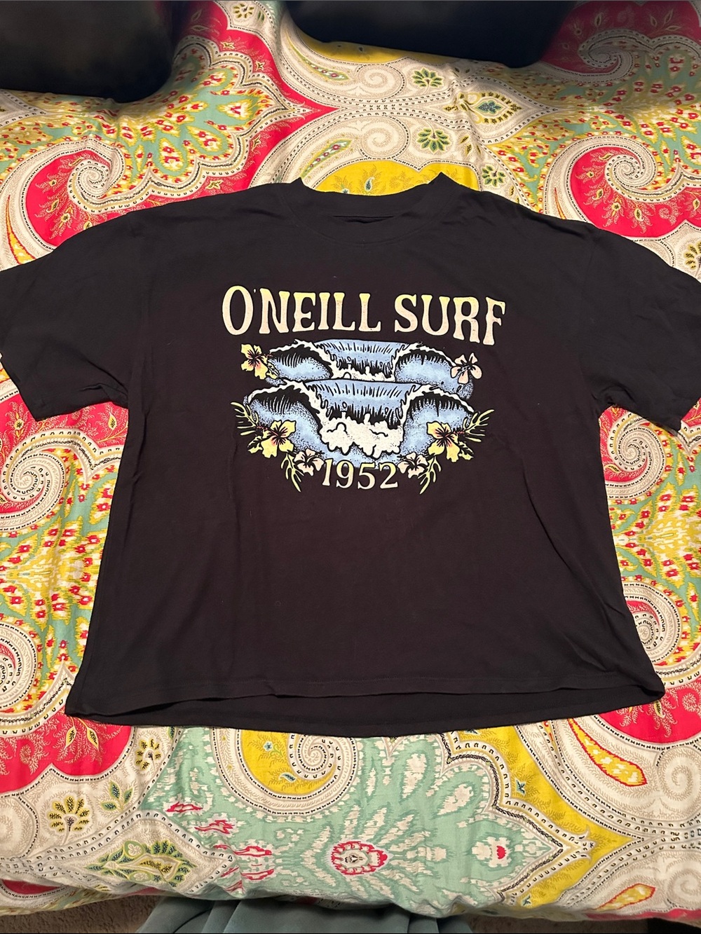 O'Neill Black Surf Graphic Tee with Blue Wave and Yellow Floral Accents